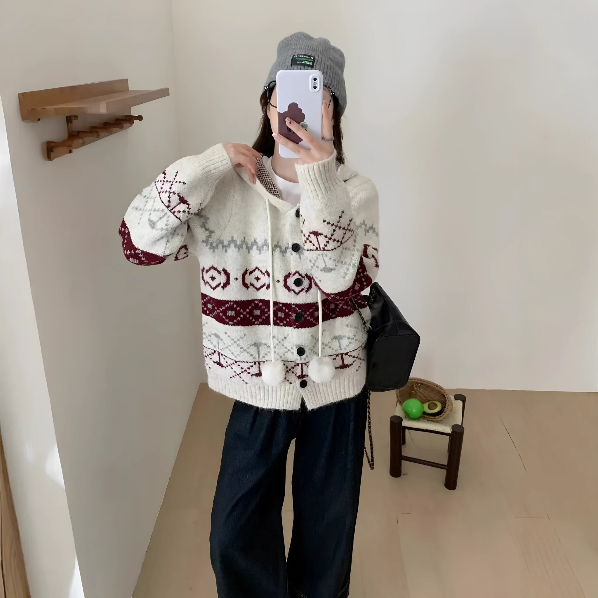 Loose fit grey geometric brocade sweater coat for plus size women on a hanger.