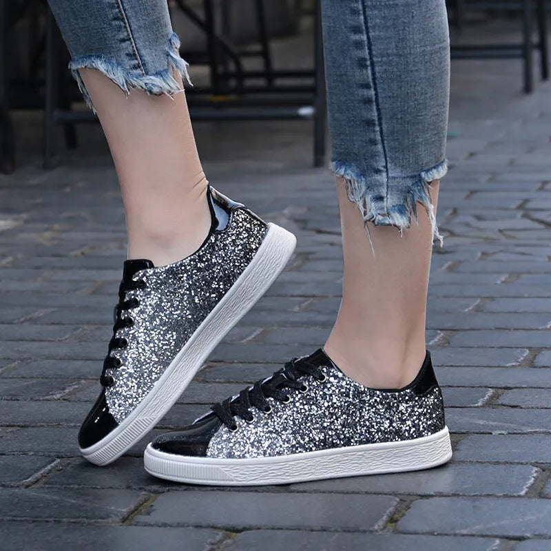 Women's black sequinned low-top lace-up shoes with a round toe and rubber sole