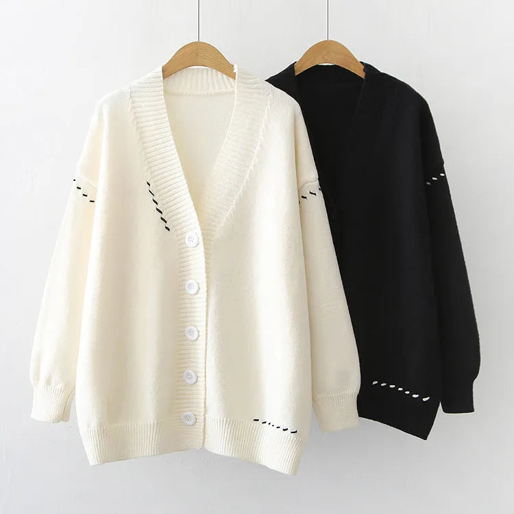 Women's loose fit knitted cardigan coat in black, long sleeve open front design.
