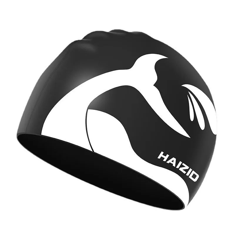 Silicone swimming cap with whale tail pattern and built-in ear protectors in choice of colours