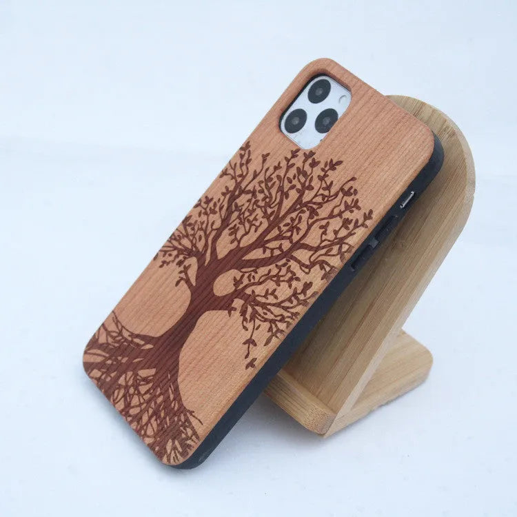 Wooden mobile phone case with solid wood back panel and TPU bumper, showing elephant print design for iPhone