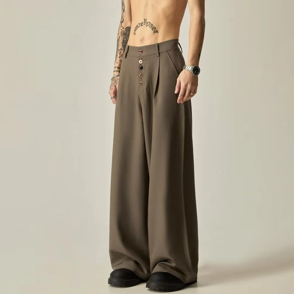 Men's solid colour wide-leg casual trousers in black, showing elastic waist and straight leg cut.