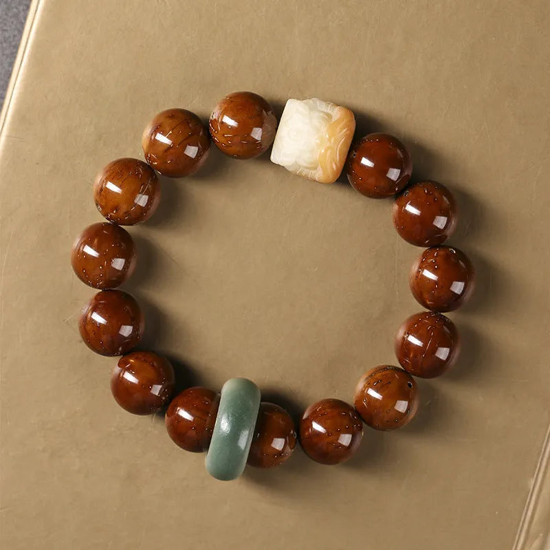 Hand-woven round bead bracelet in ivory nut lion style with 13mm beads