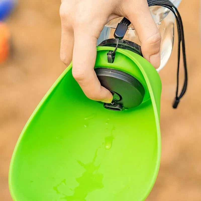 Blue plastic pet water bottle with drinking bowl showing key lock mechanism and 680ml capacity markings