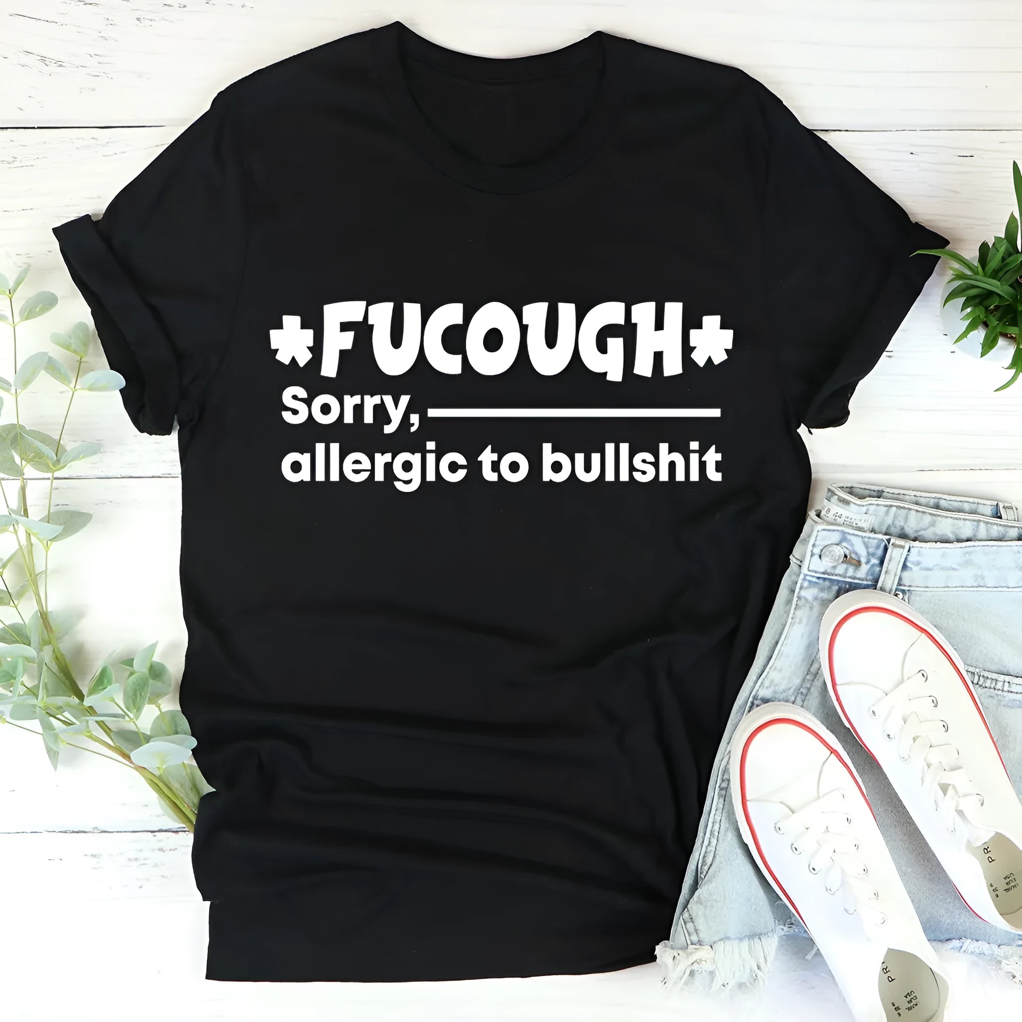 Straight cut black cotton T-shirt with short sleeves and a round neck for men and women.