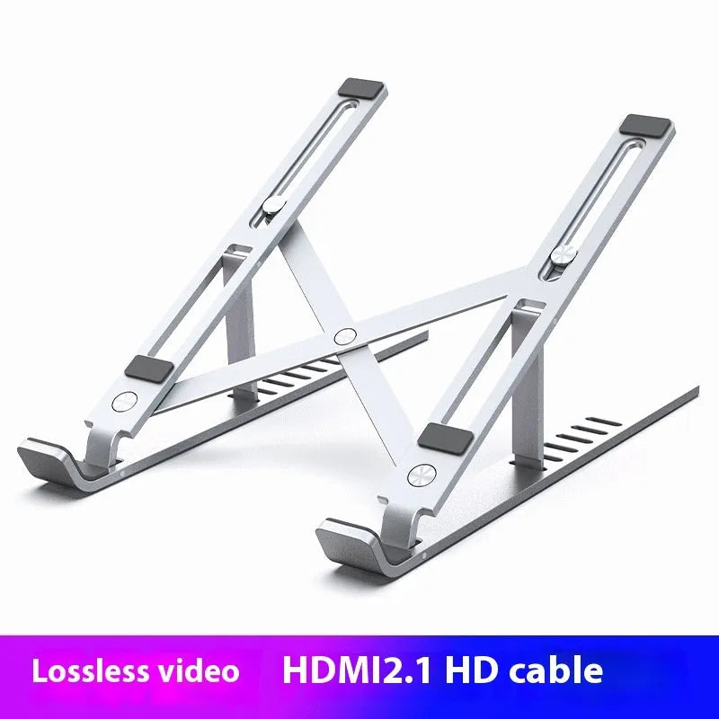 Silver aluminium alloy adjustable laptop stand on a desk with a notebook on top