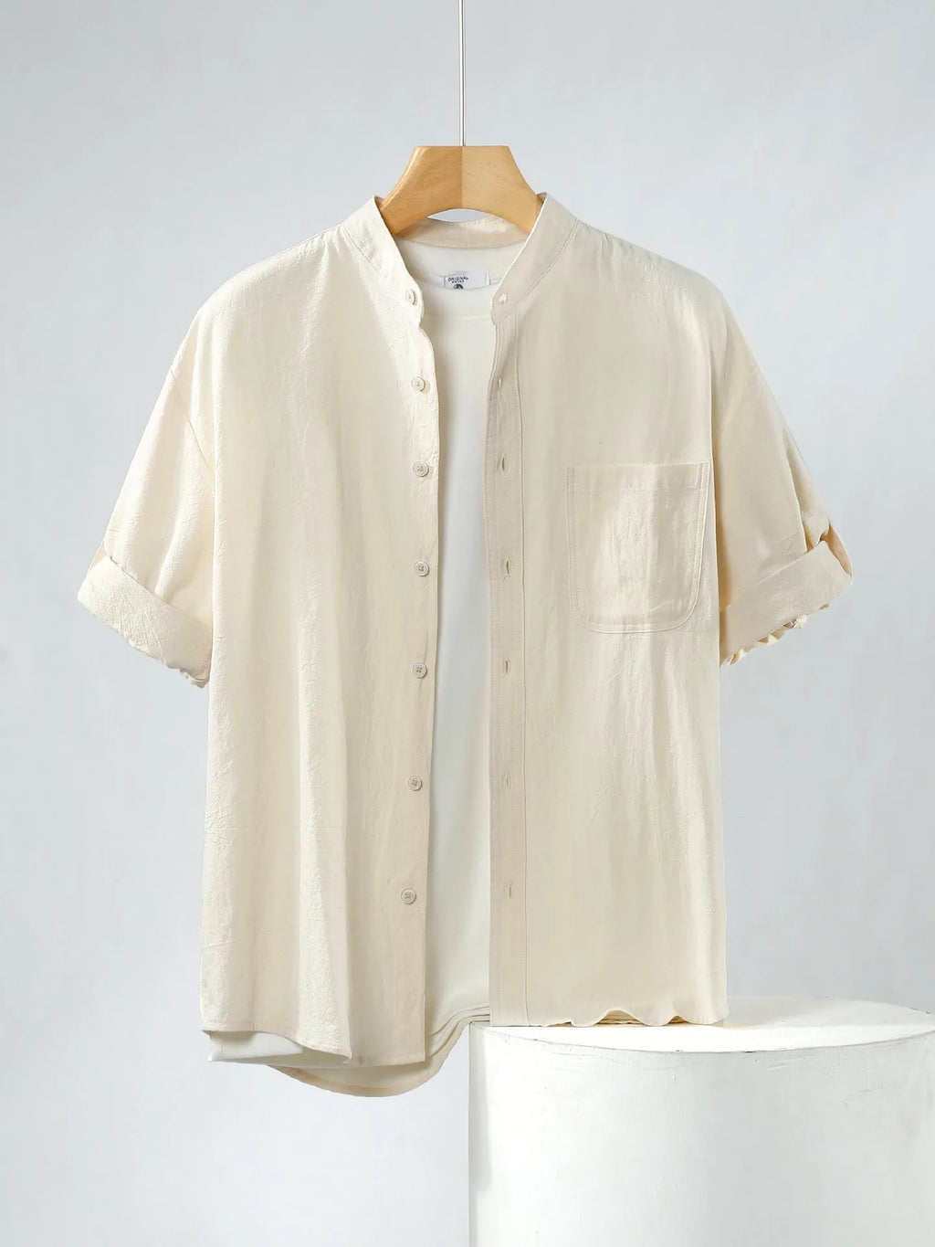 Men's loose short sleeve linen shirt in cotton blend with stand collar.