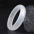 Gao Bing jade bracelet in white moonlight colour on a wrist, showing flat and round bar shape options.