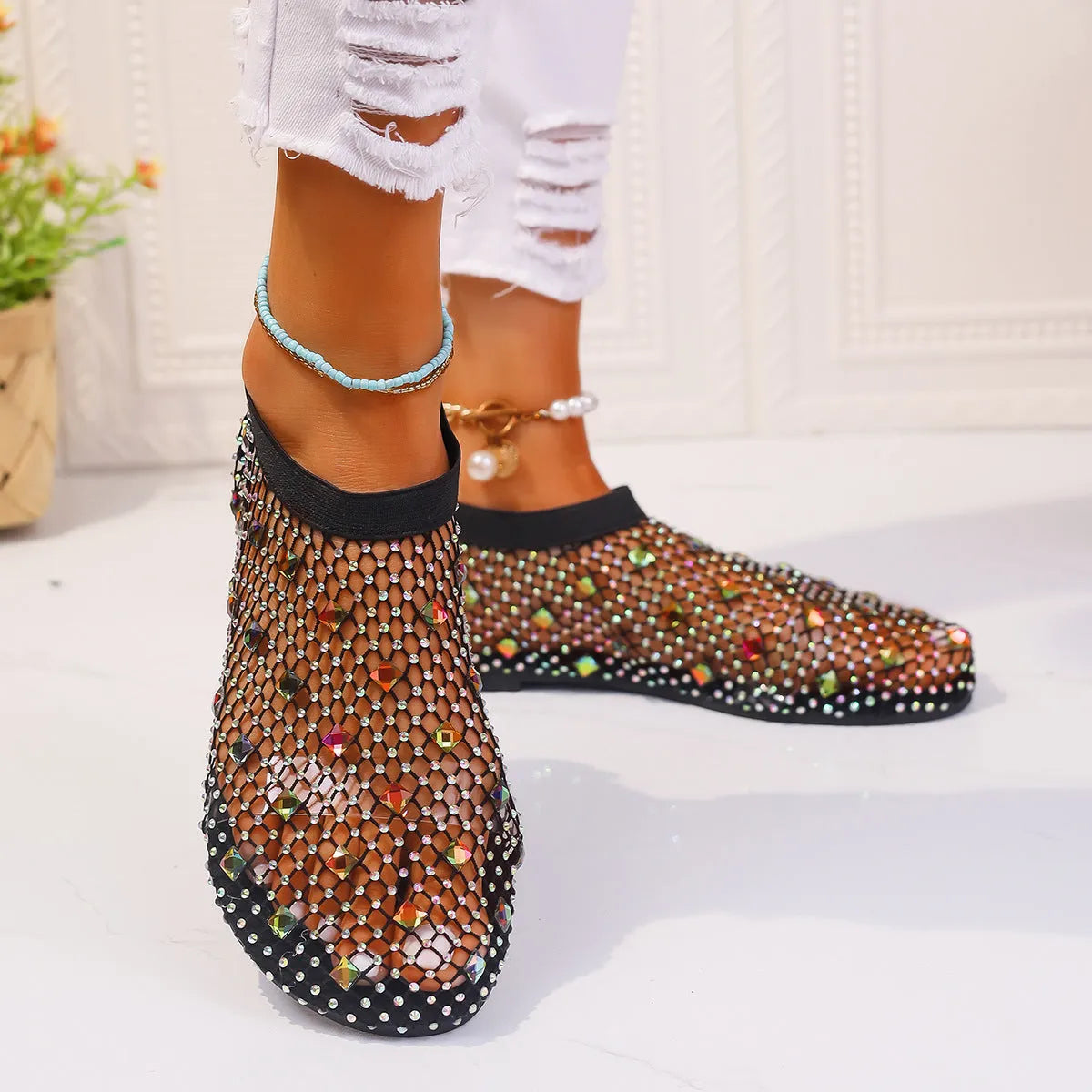 Women's colourful rhinestone mesh flat sandals on white background showing round toe design
