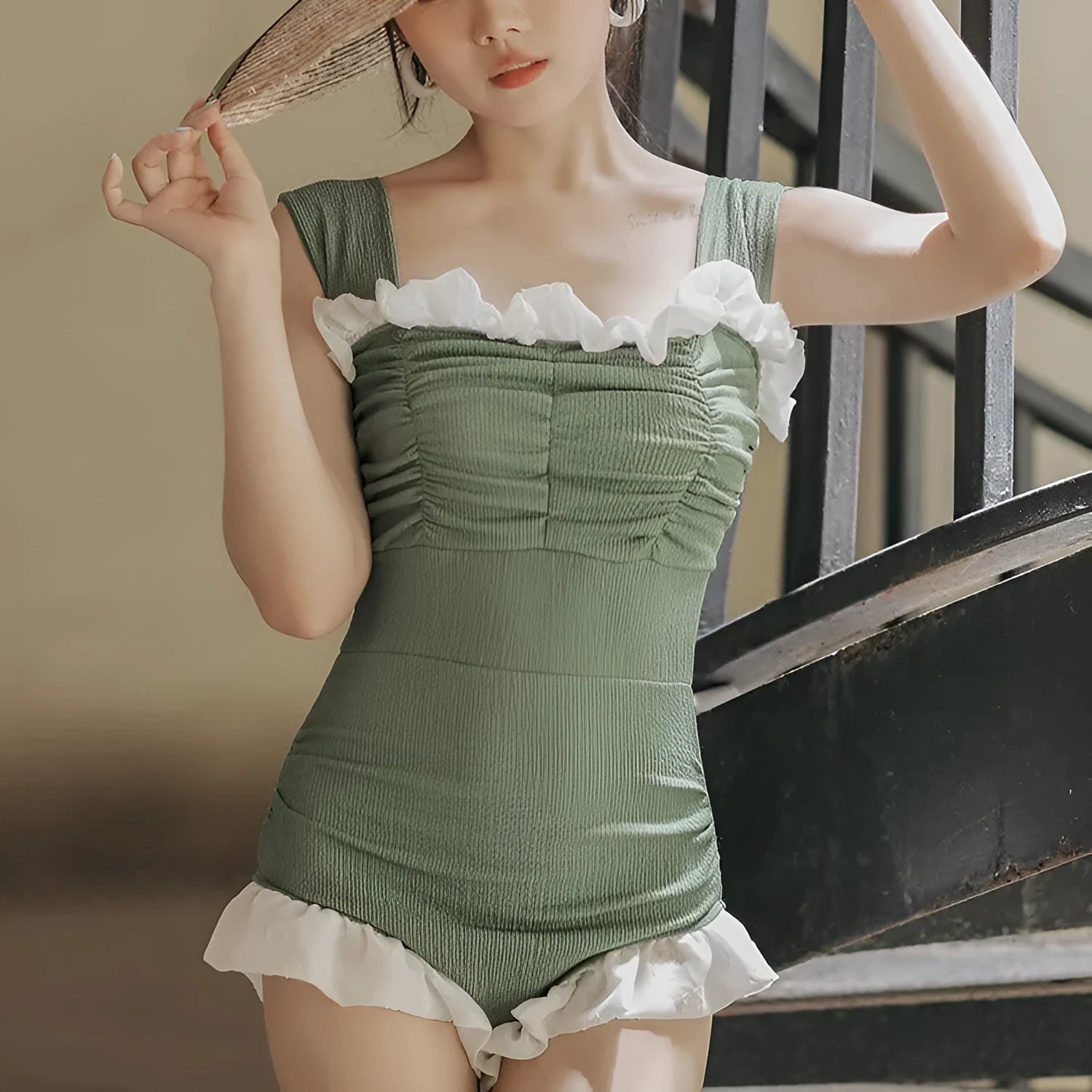 Black high-waisted one-piece swimsuit on a mannequin, showing quick-dry fabric and slimming cut.