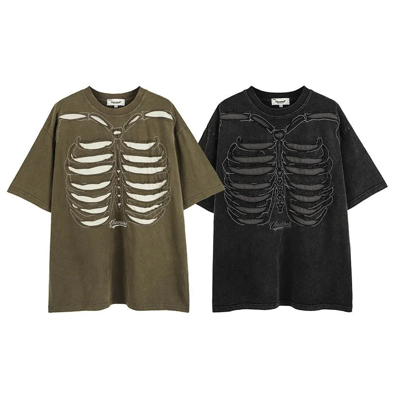 Man modelling a black loose-fit cotton short sleeve top with a white skull and letter graphic print.