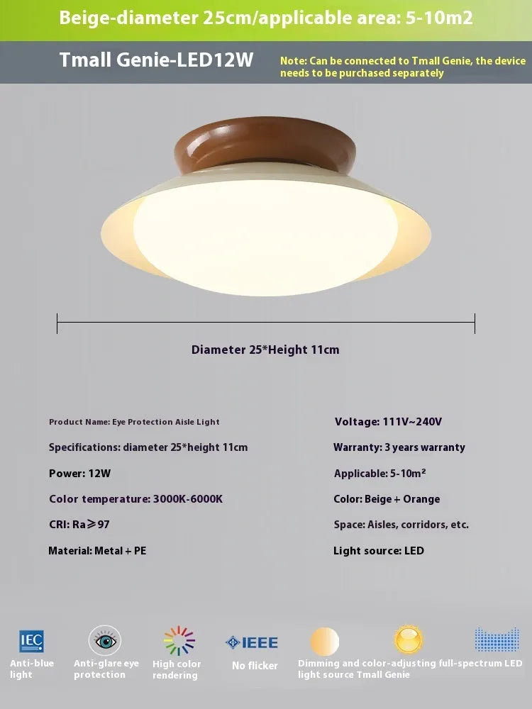 Modern minimalist cream style flying saucer ceiling lamp in a neutral colour on a ceiling.