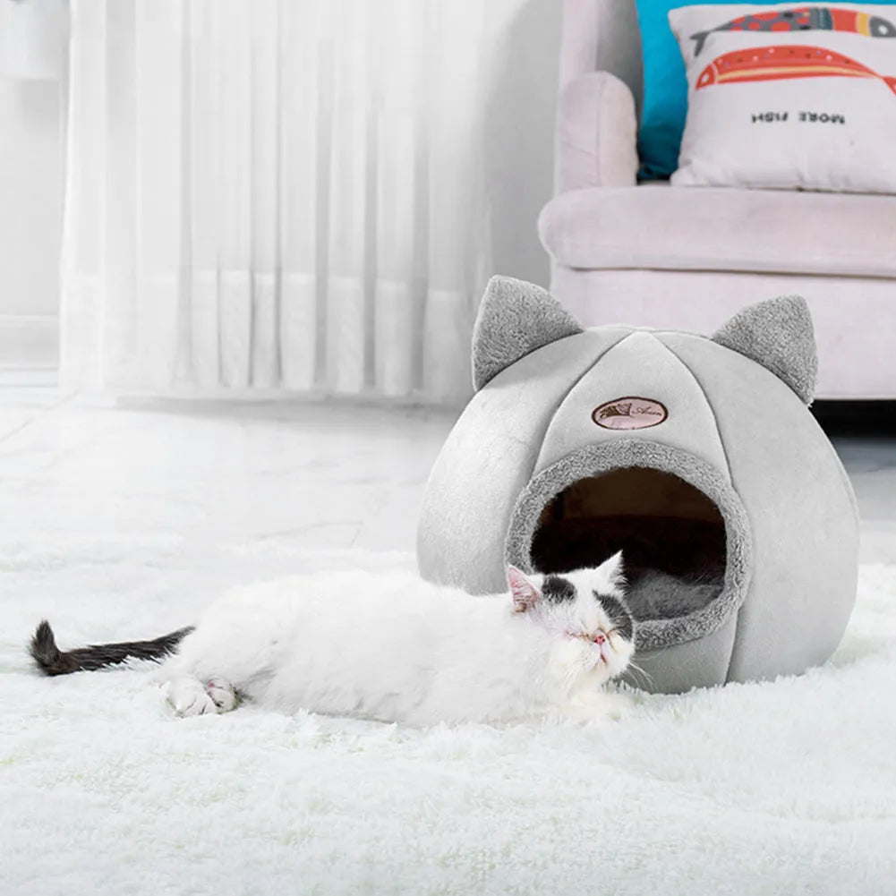 Fully enclosed plush cat winter nest sofa bed with removable cushion, shown in grey