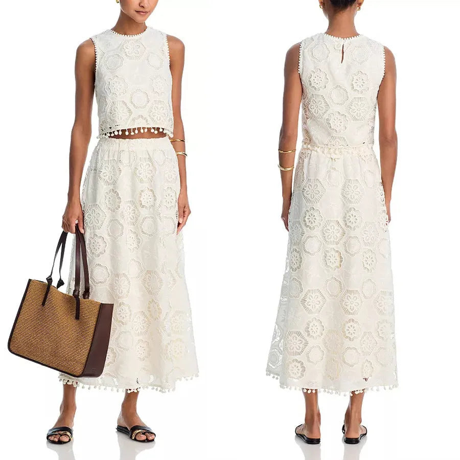 White women's retro style two-piece suit with sleeveless top, long skirt, and embroidery detail.