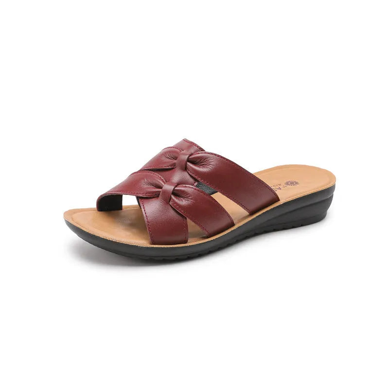 Women's cowhide slippers in beige, black, or red colours with non-slip soles and imitation leather lining