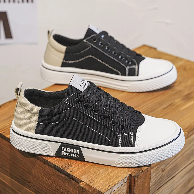 Men's low-top canvas skate shoes in blue with lace-up front and white PVC sole