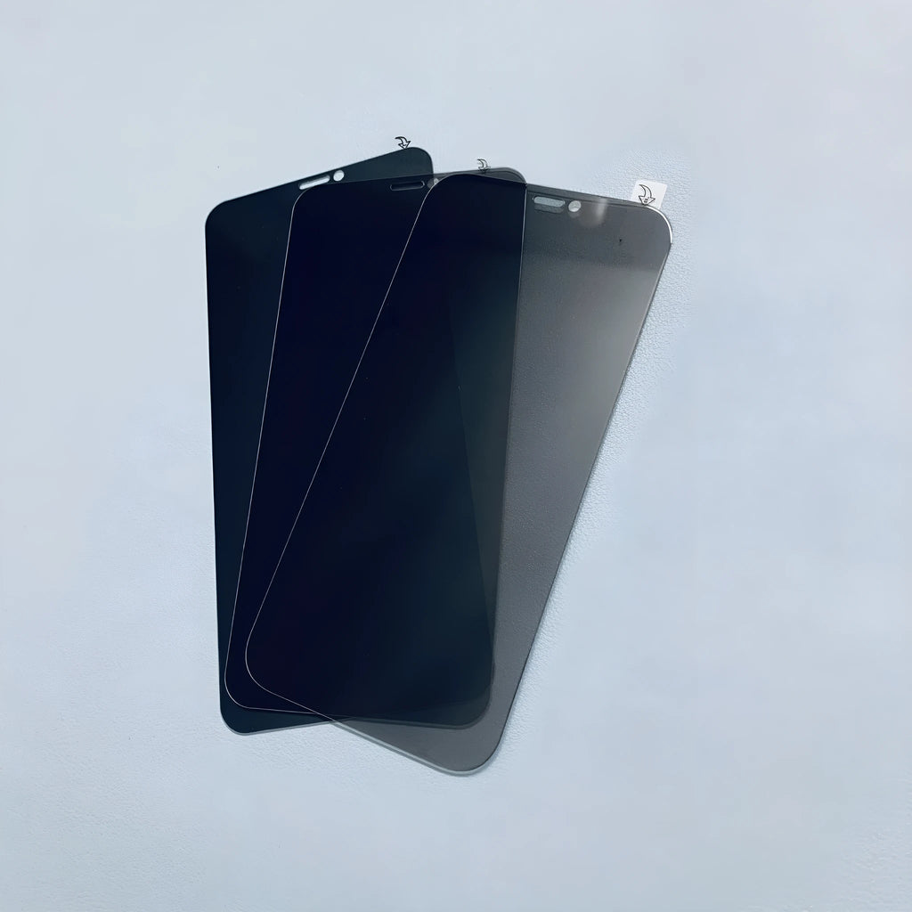 Full screen tempered glass anti peeping privacy film for iPhone on a table.