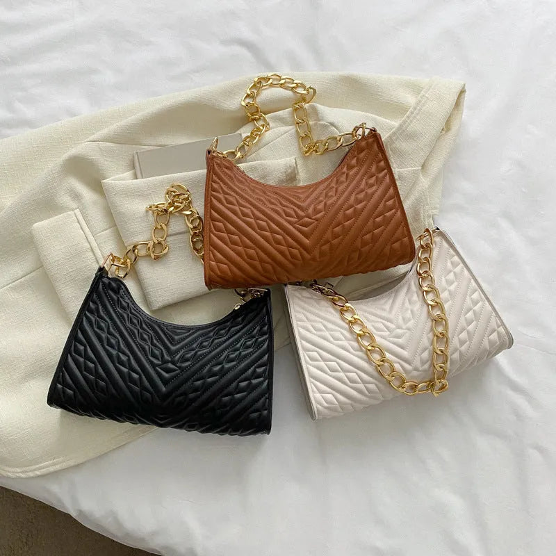Brown PU leather pleated chain baguette shoulder bag showing adjustable strap and square shape