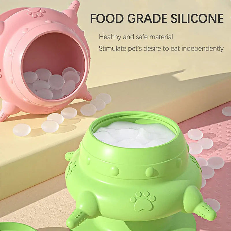 Pink silicone pet nursing bottle with four teats and a flat base.