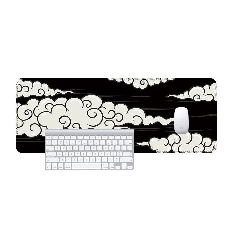 Large cloud pattern desk mat with natural rubber non-slip base on a wooden desk
