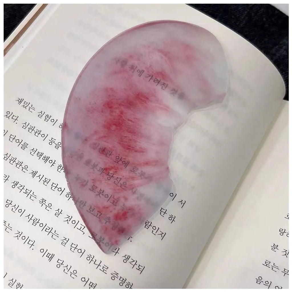 Cute transparent plastic fruit bookmark in watermelon red colour, approximately 8-10cm long, with a cartoon fruit shape.