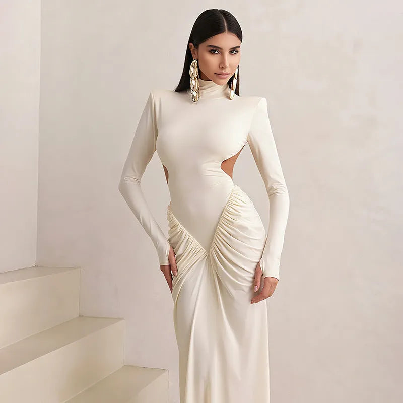 Women's long sleeve high collar slim fit dress with pleated backless detail in apricot colour.