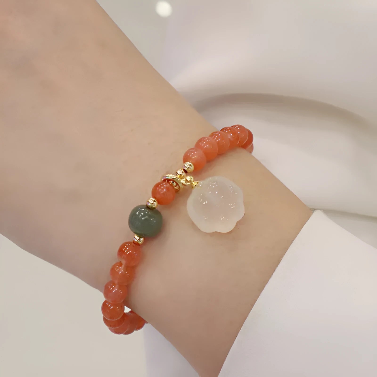 8mm natural red agate bracelet with jade inlay and cat paw animal charm