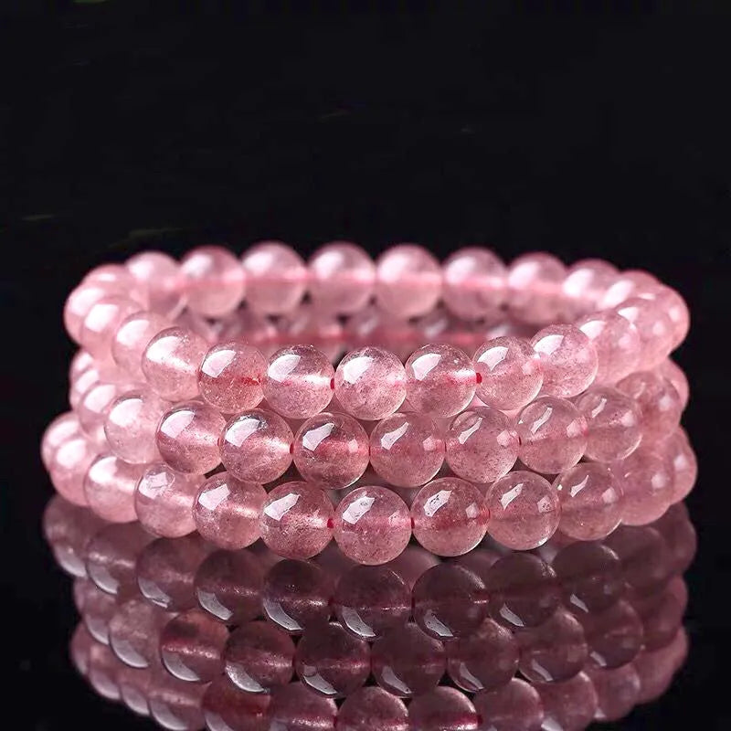 Women's strawberry quartz crystal bracelet with polished beads in three size options