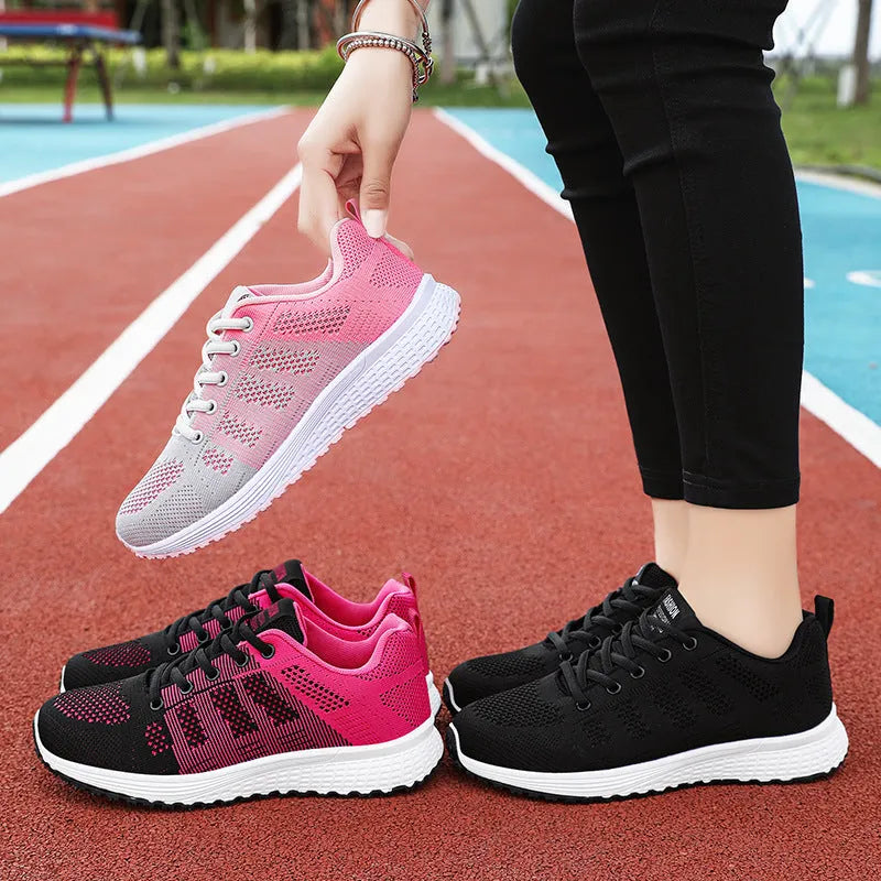 Women's flyknit running shoes in black with lace-up front and round toe design