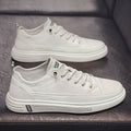 Men's white casual shoes with round toe, low heel, and shallow opening in Korean style