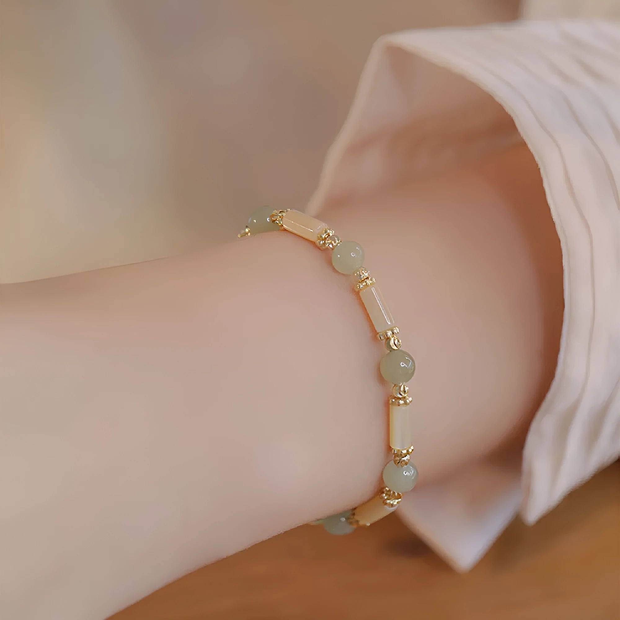 Women's Hetian jade bamboo joint bracelet in 6mm size, shown in jade and South red colours.
