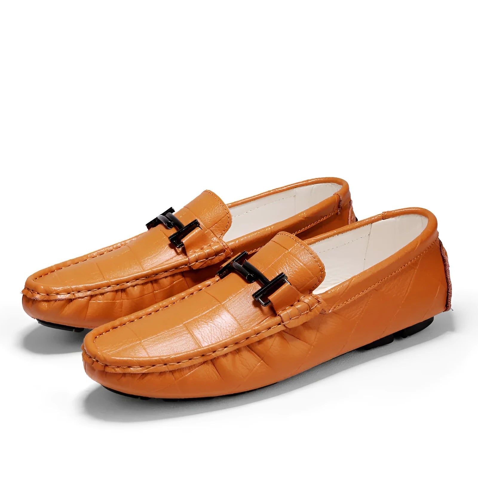 Men's black leather peas shoes with a silver belt buckle and flat rubber sole.