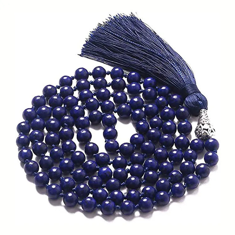 Long geometric agate and gemstone tassel necklace showing colourful beads including amethyst and lapis lazuli.
