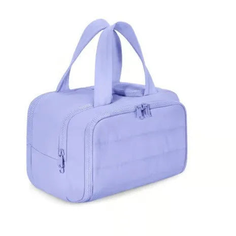 Large open travel toiletry bag in soft-touch polyester fabric, shown in a light blue colour.