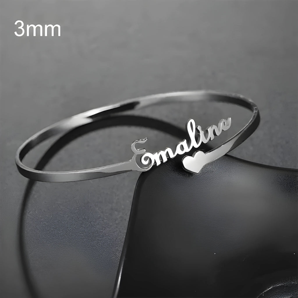 Personalised name bracelet in stainless steel with 10mm width, shown in silver, gold, or rose gold