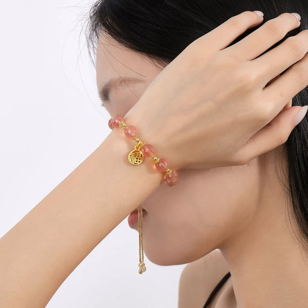Pink strawberry quartz geometric bracelet with electroplated finish and fu character detail