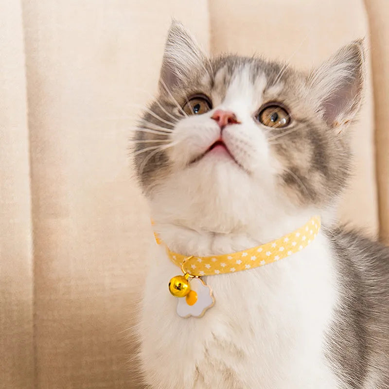 Small adjustable pet collar with bell and bow tie accessory in green, pink, or yellow colours