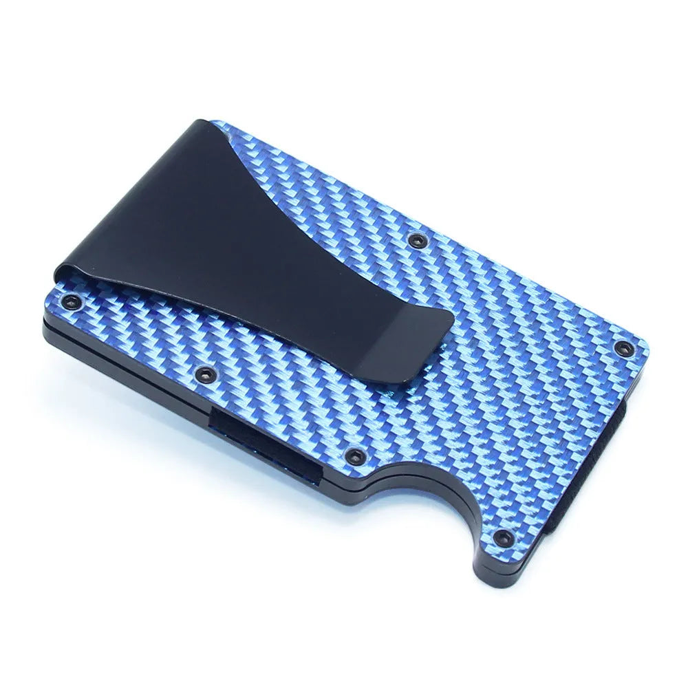 Slim black carbon fibre card holder wallet with geometric design on a desk.