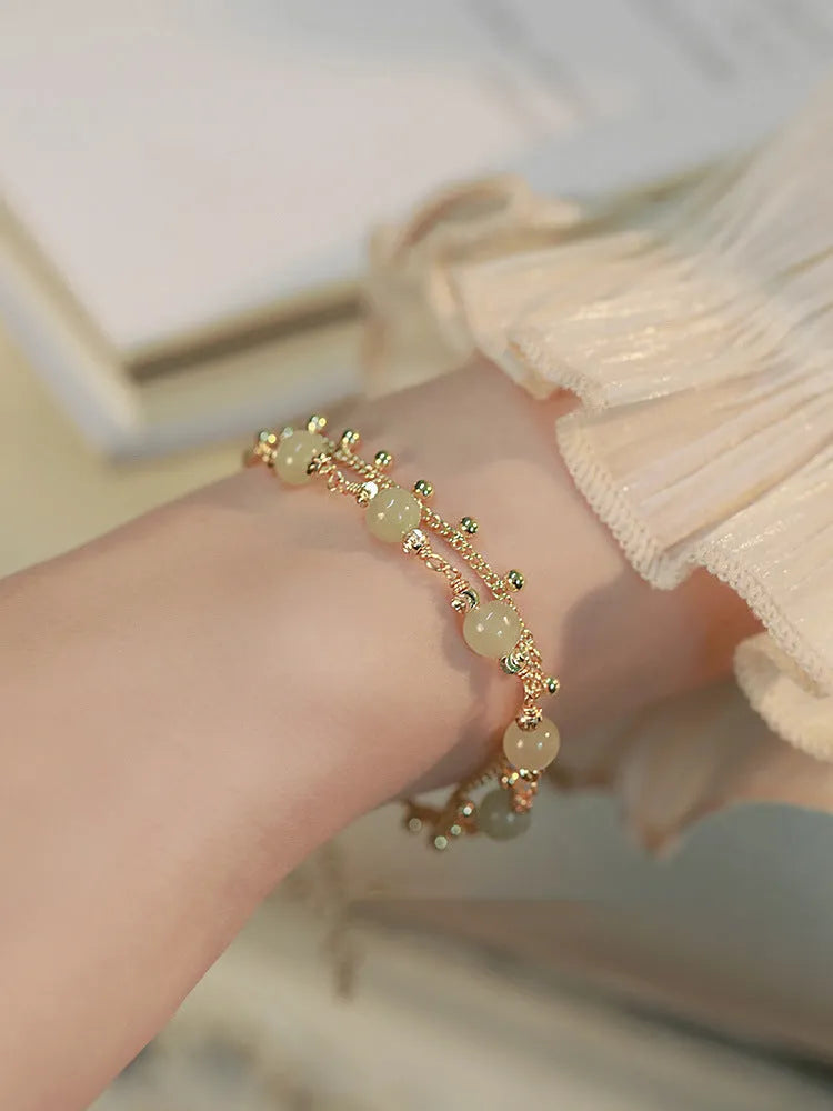 Natural Hetian jade beaded bracelet in classic princess running style for women.