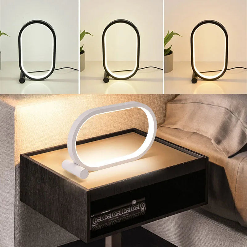 USB plug-in oval acrylic touch lamp with dimmable LED, metal body, on a bedside table