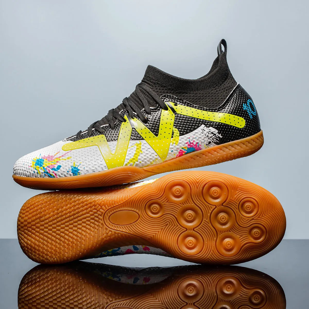 Black and yellow low-top football boots with removable studs on a non-slip rubber sole.