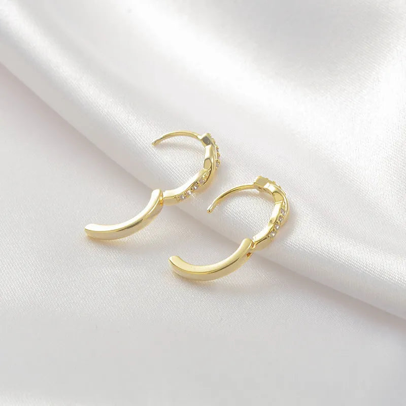 Geometric women's earrings with interwoven hemp rope design on copper framework in gold finish