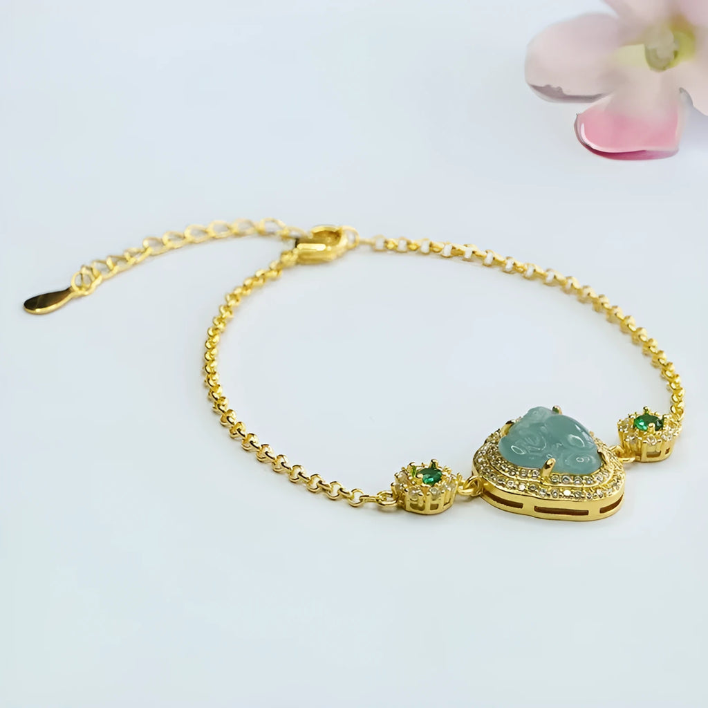 Women's jade bracelet with an inlaid blue Maitreya Buddha charm measuring 10mm by 13mm.