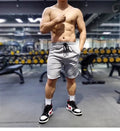 Men's black quick-dry running shorts with contrast blue stitching, shown flat.