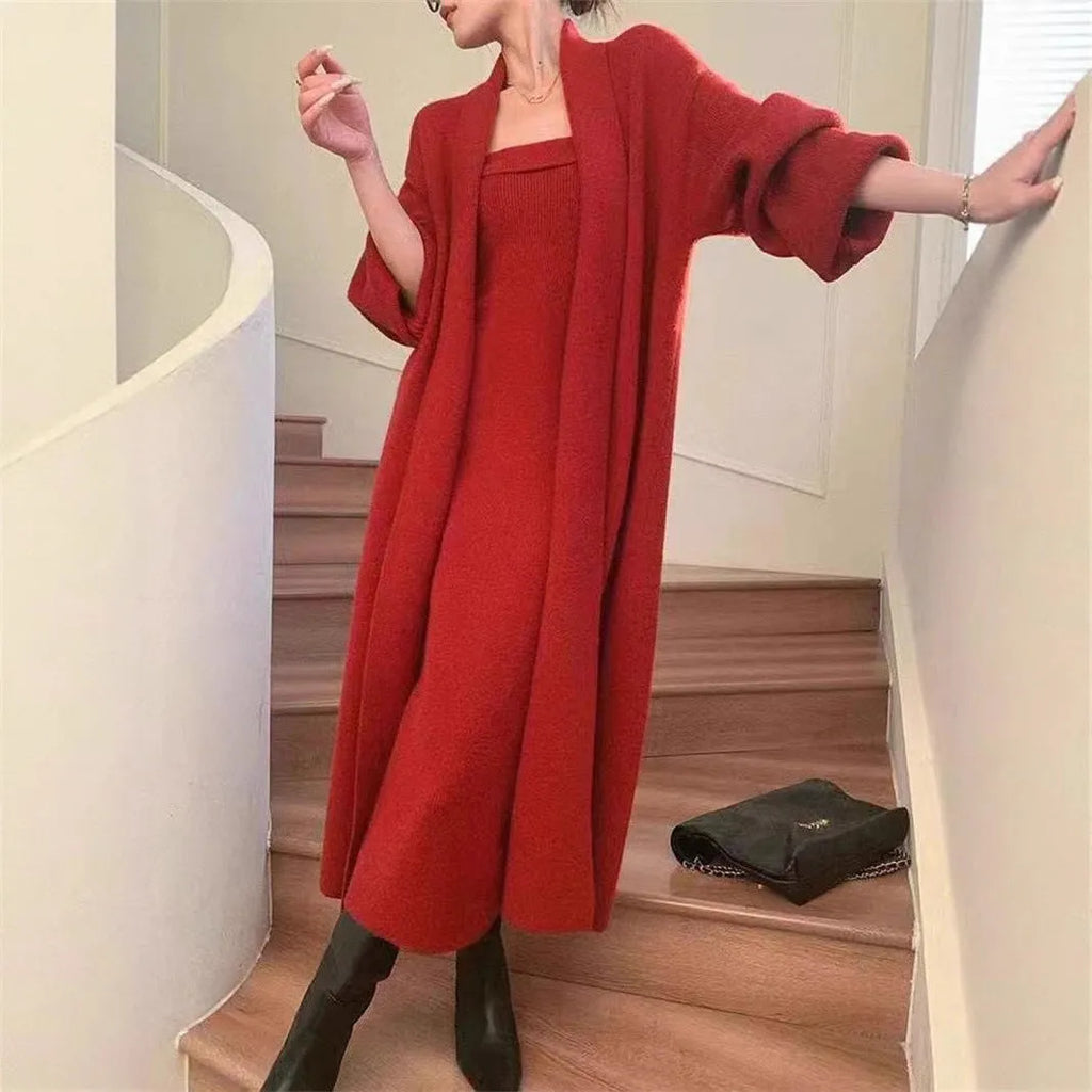 Women's grey knitted cardigan dress and matching coat set on a hanger.
