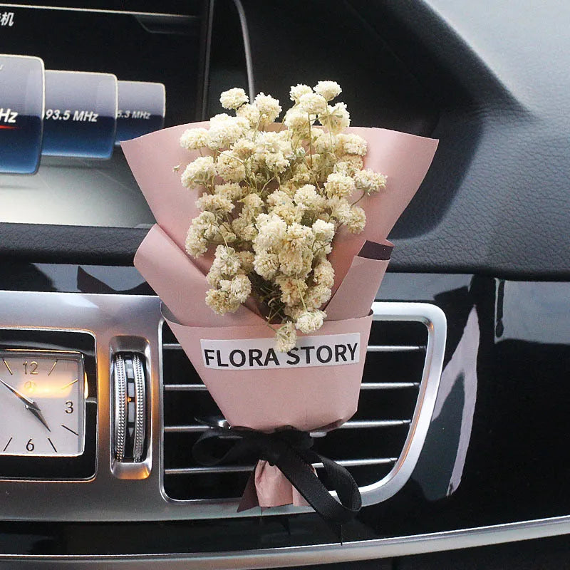 Dried flower car air freshener with natural aroma slices mounted on vehicle air conditioning vent