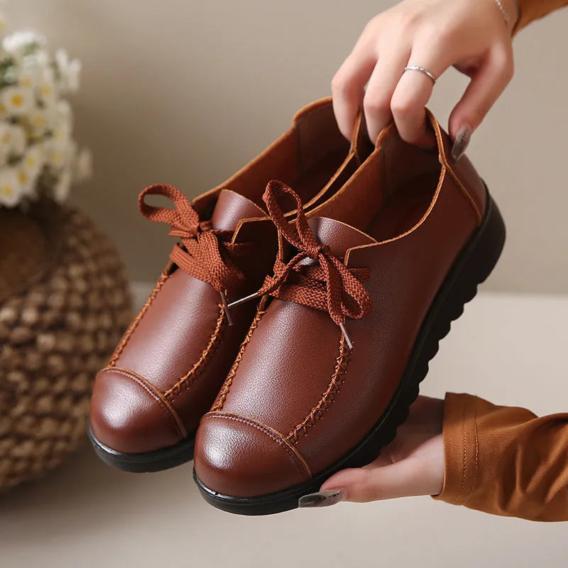 Women's black flat work shoes with microfiber upper, round toe, front lacing and anti-slip polyurethane sole