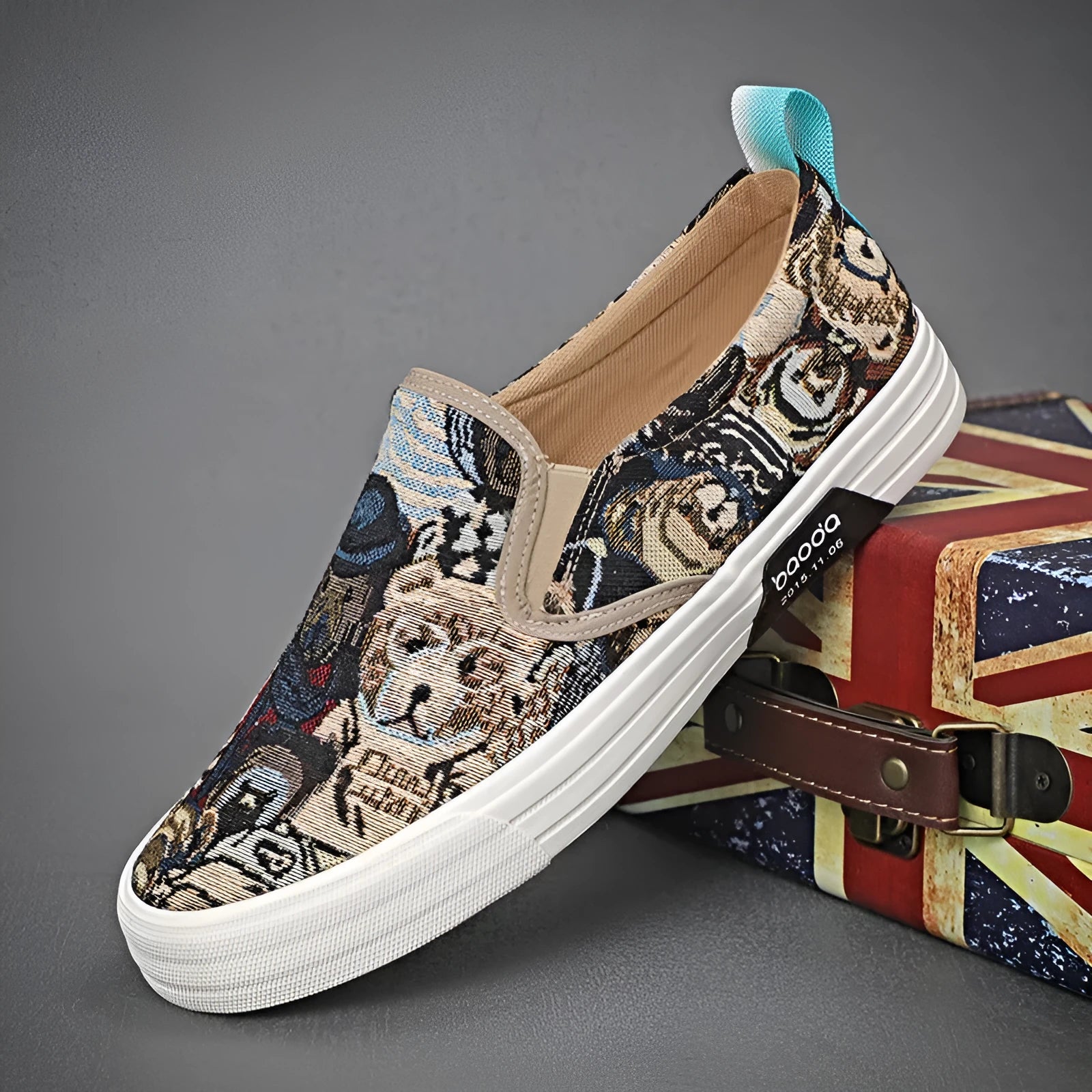 A pair of low-top canvas slip-on sneakers with a round toe and vulcanised rubber sole on a neutral background.