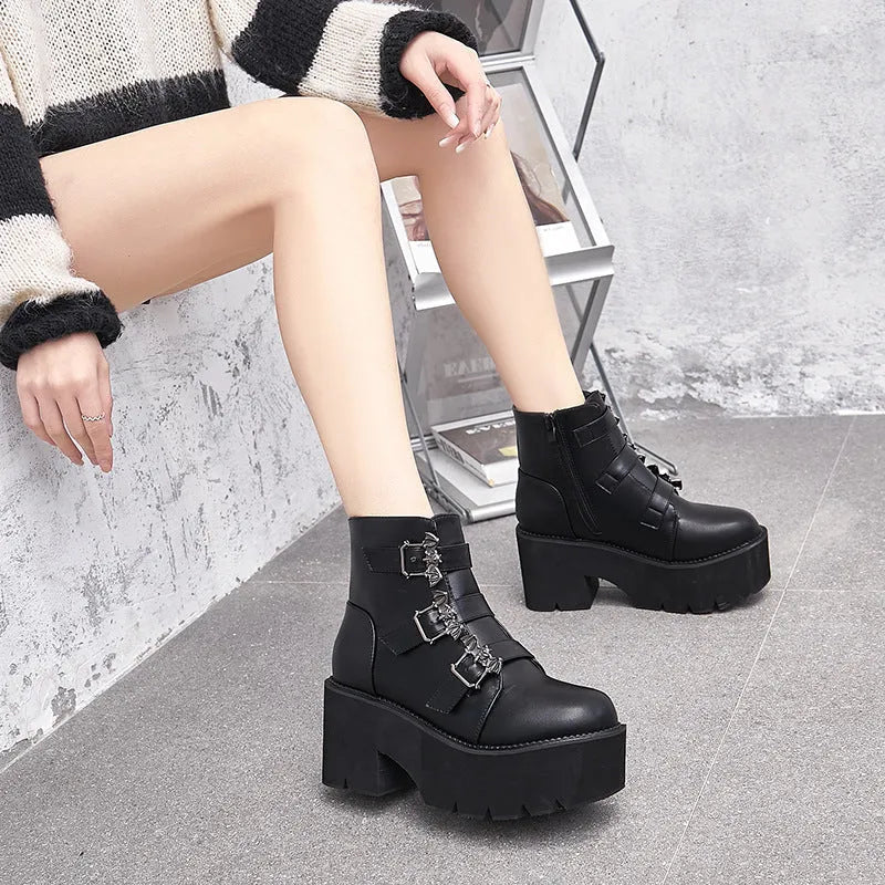 Black women's punk gothic short ankle boots with a bat buckle and side zip.