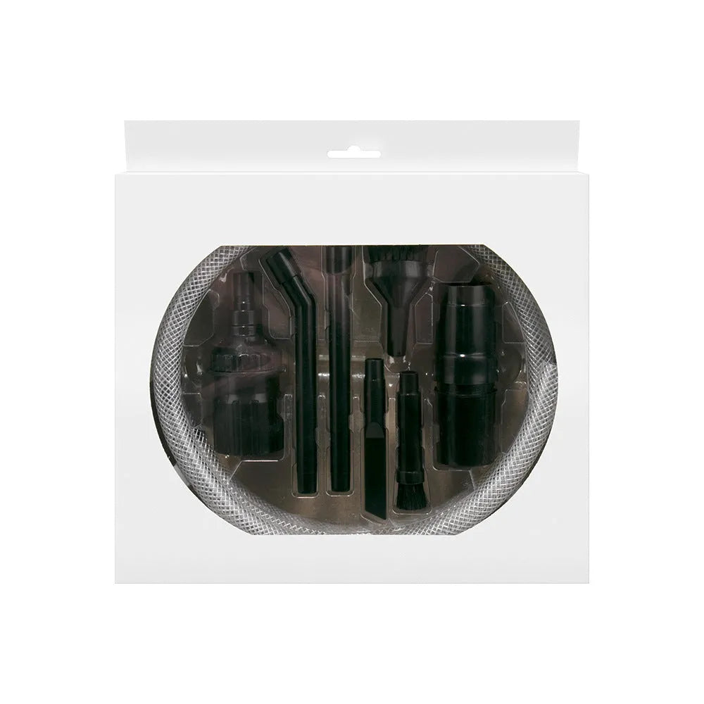 Eight different vacuum cleaner nozzle attachments laid out for a multifunctional cleaning set.